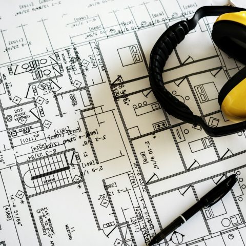 Blueprint and earmuffs